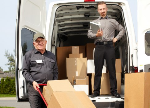 Professional mover carrying items for a flat removal in Southlambeth