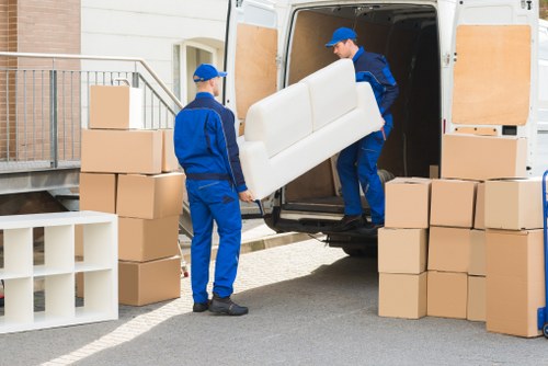 Man with van loading furniture in Southlambeth street