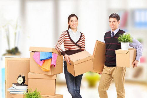 Staff using safe lifting techniques during relocation