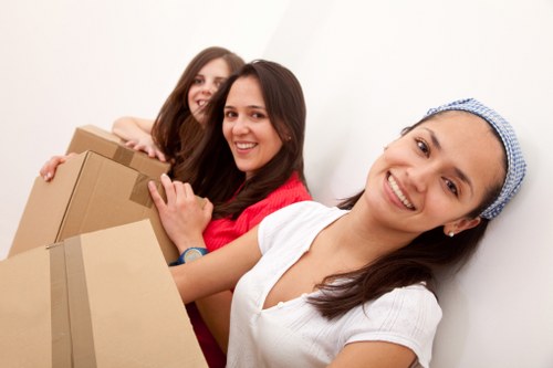 Movers using secure handling tools to protect furniture during transit