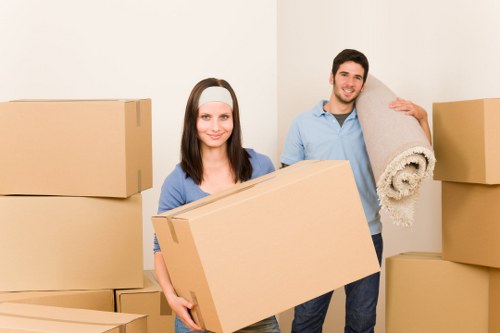 A trained removals team working carefully in a property corridor