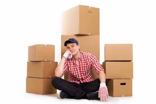 House removal team handling boxes and furniture in Southlambeth